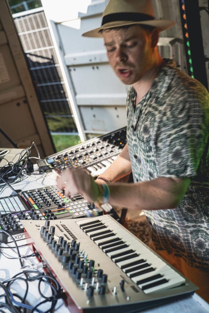 Yannick Trachsel performing live on synths and keys at an outdoor show